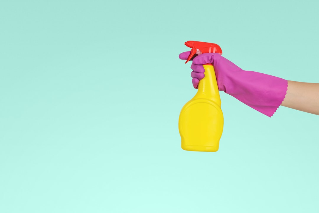 about-02 person-holding-yellow-plastic-spray-bottle-zmnefoi3k